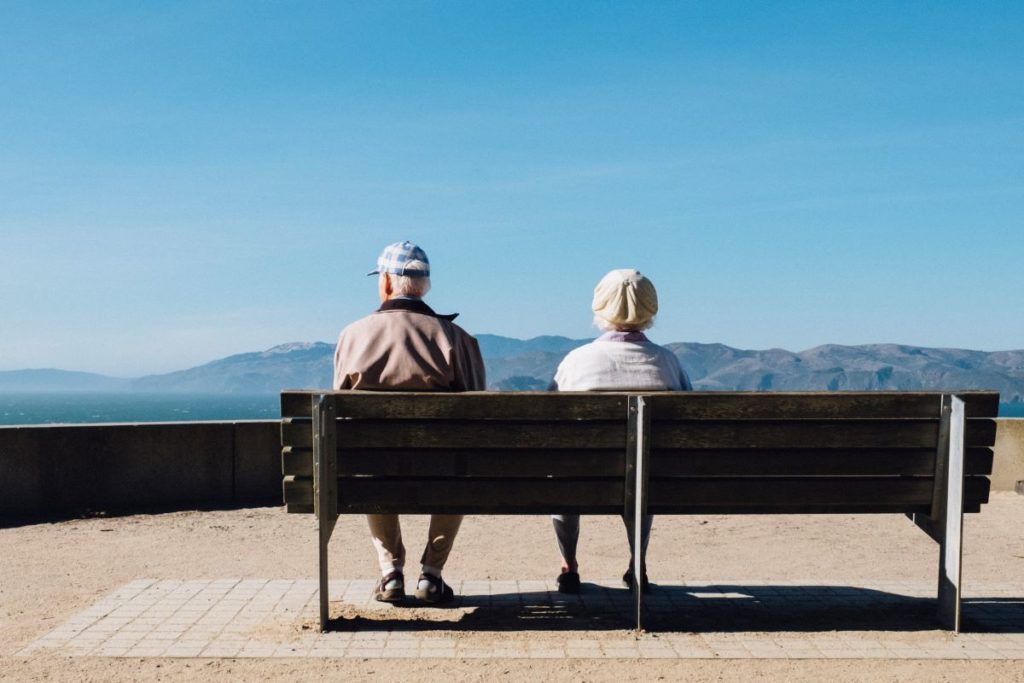 elder couple sitting on bench